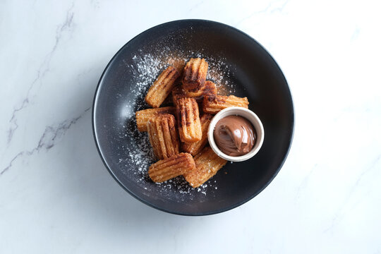 Churros dish with chocolate dip
