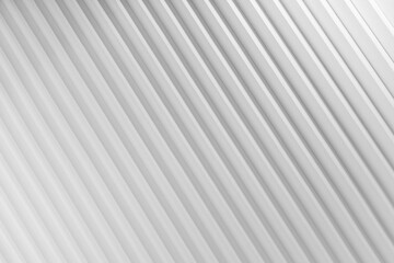 White abstract background of diagonal parallel stripes pattern with gradient light, top view, backdrop for advertising, design, card, poster, flyer, text in elegant soft minimalistic geometric style.
