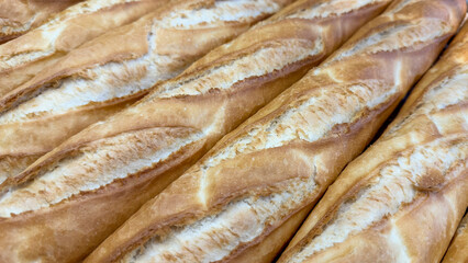 Baguette bread. Close-up of breads lined up on the oven counter