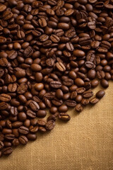 Coffee beans on canvas. Background with copy space, vertical. AI generative.