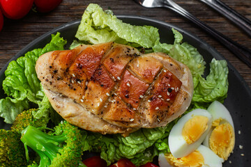 Baked chicken fillet with vegetables in a plate