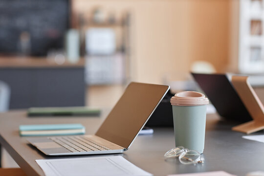 Background image of minimal office workplace with laptop and pink accents, copy space