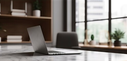 Modern Office Workspace with Laptop on Table for Business. Copy Space Available