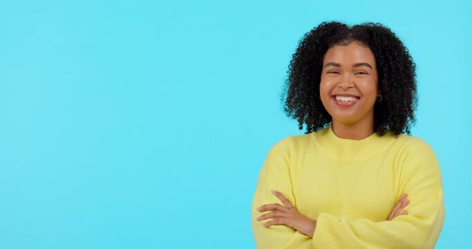 Smile, option and pointing with a black woman on a blue background in studio to decide on a selection. Portrait, decision and laughter with a happy young afro female person showing her choice