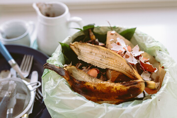 Leftover food in trash can in kitchen