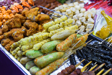 Many snacks and seafood in vietnamese night market in food festival