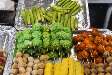 Many snacks and seafood in vietnamese night market in food festival