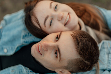 Happy young Loving young couple relaxing with eyes closed, head on shoulder