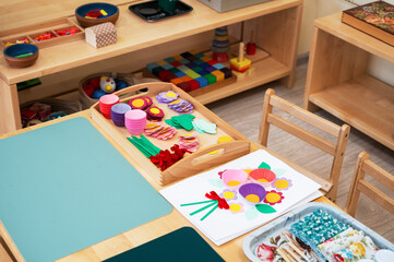Classroom of Montessori kindergarten. The colorful Montessori material. Concept of children learning toy