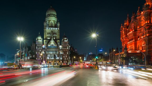 Timelapse view of traffic in front of historic landmark Chhatrapati Shivaji Terminus aka Victoria Station at night in South Mumbai, Maharashtra, India. 
