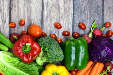 Top view of vegetables on wood background with copy space for text.