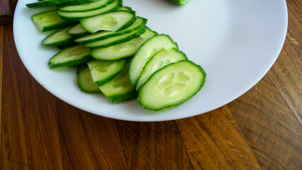 Chopped cucumbers. Sliced cucumbers on a plate