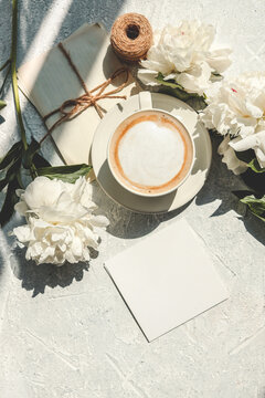 Blank card with space for text, peonies and coffee cup, holiday concept