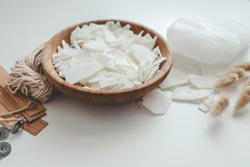 Set for crafting candle on white background. Eco soy wax and candle making tools top view, flat lay. DIY candles. Hobby concept
