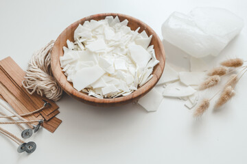 Set for crafting candle on white background. Eco soy wax and candle making tools top view, flat...