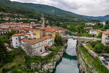 Fototapeta na wymiar Aerial drone view of Kanal na Soci town in Slovenia and Soca river.