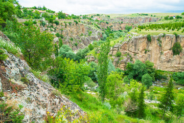 Fototapeta na wymiar Ihlara Valley in Turkey, Known as Ihlara Vadisi in Turkish, the valley is biggest canyon and has a green trees and small river.