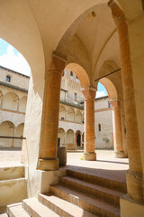 Fototapeta premium interior of the Castle Torrechiara in Langhirano, Italy across arches and columns inside
