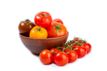 Various colorful tomatoes isolated on white background. Fresh yellow, red, black, pink and brown tomatoes. Fresh vegetables. Vegan. Close-up. Healthy food. Salad Ingredients.