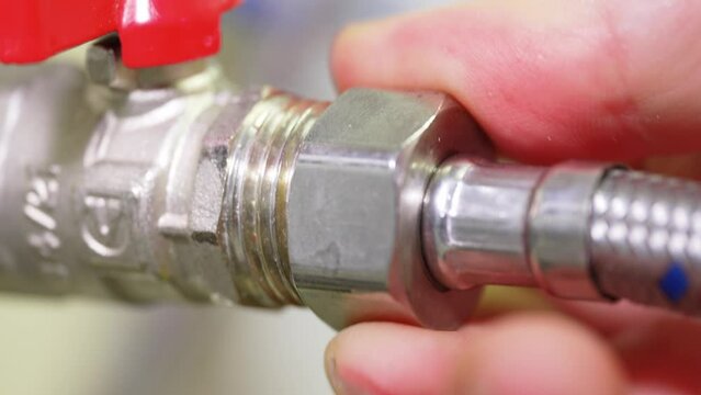 Connection of the water pipe. flexible hose. plumbing threaded connection.