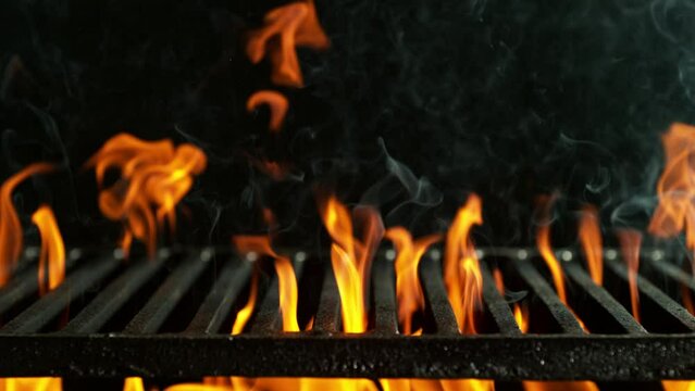 Super slow motion of flames with empty grill grid. Filmed on high speed cinema camera, 1000 fps. Camera placed on high speed cine bot, moving down. Speed Ramp Effect.