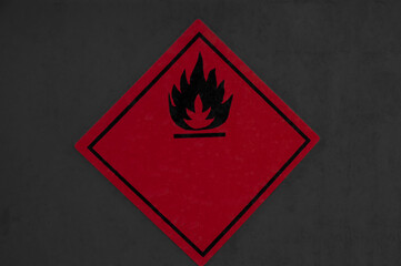 fire ban concept. painted fire in a red rhombus on a grey background. flammable material transportation illustration