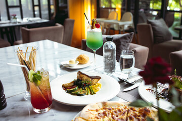 Luxury table settings for fine dining served and decorated table with food for guests in the restaurant