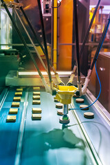 automatic vacuum suckers with conveyor in Production of biscuits in a manufacture factory for the food industry