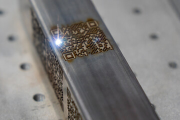 The barcode on square metal  pipe from etching machine.