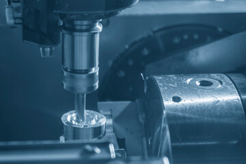 The CNC milling machine slot cutting the automotive parts by flat end mill tools.