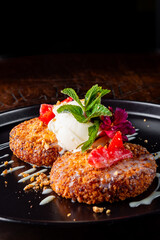 cheese pancakes with ice cream and sweet sauce