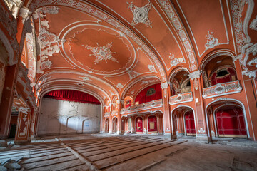 Fototapeta na wymiar Exploring the Historic Abandoned Red Cinema and Abandoned Red Theatre in Miskolc, HungaryJourney Through Time and Culture