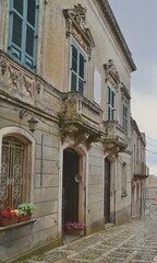 Fototapeta na wymiar Charming cobblestone street in the Hill Town of Erice in Trapani Province, Sicily