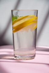 Fresh summer drink on pink table