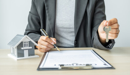 real estate agent hand holding pen and explains the business contract, rent, purchase, mortgage, a loan, or home insurance to buyer woman