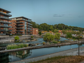 the town center of Silkeborg with the Gudena river in the soft evening light