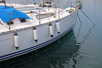 Sailing in Sardinia, Italy. Sailing yacht fenders on starboard side. Inflatable fender buoys.