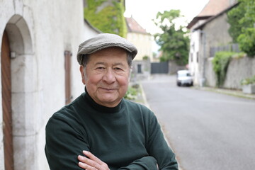 Senior ethnic businessman with arms crossed 