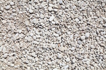 White stone beach background in Sardinia island, Italy. White zen stone texture.