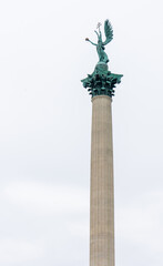 The column with Archangel Gabriel, who holds the Hungarian Holy Crown and the apostolic double cross in his hands in Heroes' Square in Budapest, Hungary