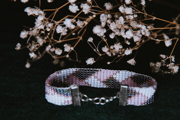 beaded bracelet with a clasp on a velor background 