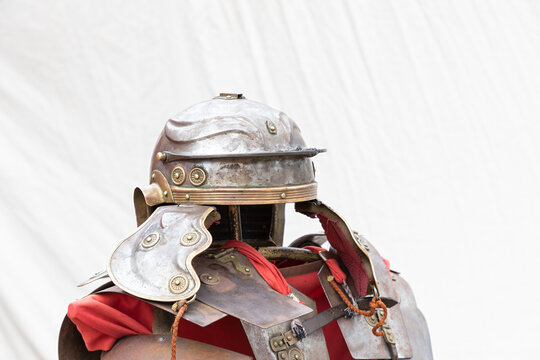 foreground of helmet and armor of an ancient roman empire soldier, lorica segmentata and imperial helmet or galea