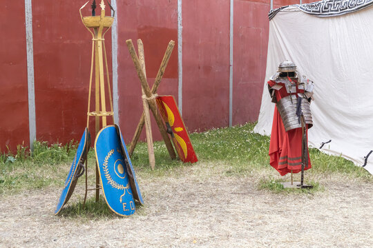 outdoor scene with shields and clothing of legionary soldier of the ancient roman empire