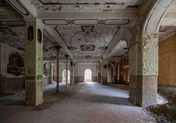 Fototapeta premium Exploring the Historic Abandoned Red Cinema and Abandoned Red Theatre in Miskolc, HungaryJourney Through Time and Culture