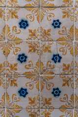 A yellow and withe tile pattern of Oporto, Portugal
