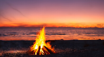 beautiful campfire in the middle of a beautiful beach in a nice sunset