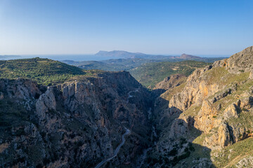 Aerial summer sunny view of serpentine mountain road near Topolia Gorge, Crete, Greece