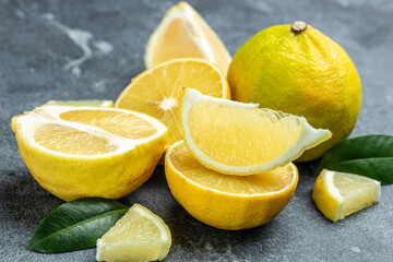 Fresh ripe bergamot orange fruits, fragrant citrus used in earl grey tea, medicine and spa treatments, close up - obrazy, fototapety, plakaty