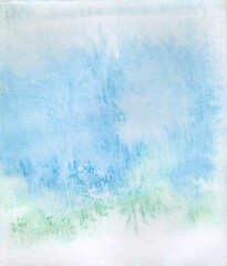 abstract background painted with watercolors in blue and green pastel tones evoking a landscape