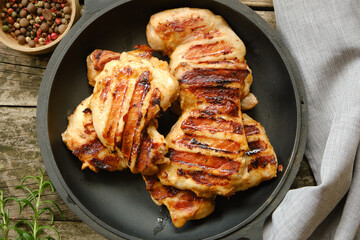 Grilled chicken or turkey thigh fillet. View from above. Top view, flat lay.